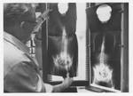 Dr. Koch Examines X-Ray by Philadelphia College of Osteopathic Medicine