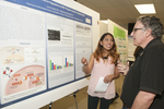 Presenting at Research Day by Lucia Cavero and Robert Barsotti